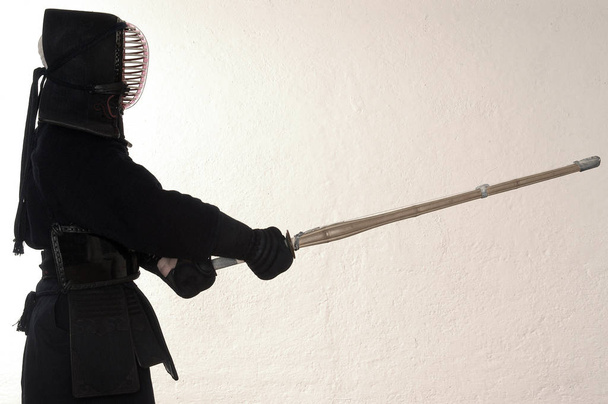 silhouette of a woman with a sword - Foto, Bild