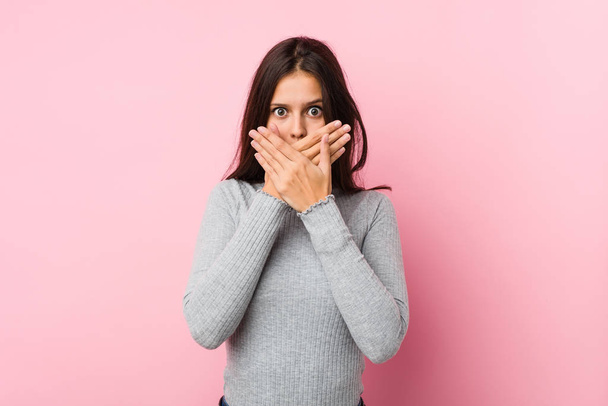 Young cute woman shocked covering mouth with hands. - Photo, Image