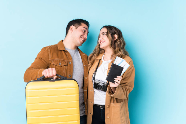 Young latin couple ready for travelling - 写真・画像