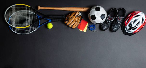 High Angle View Of Various Sports Accessories Over Black Background - Fotoğraf, Görsel