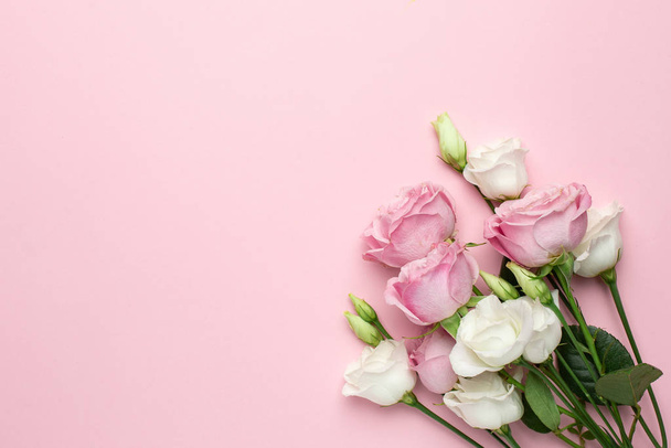 Pink and white roses flowers on pink background with copyspace. Minimalistic composition for the holidays,valentines day and womens day. - Foto, Imagen