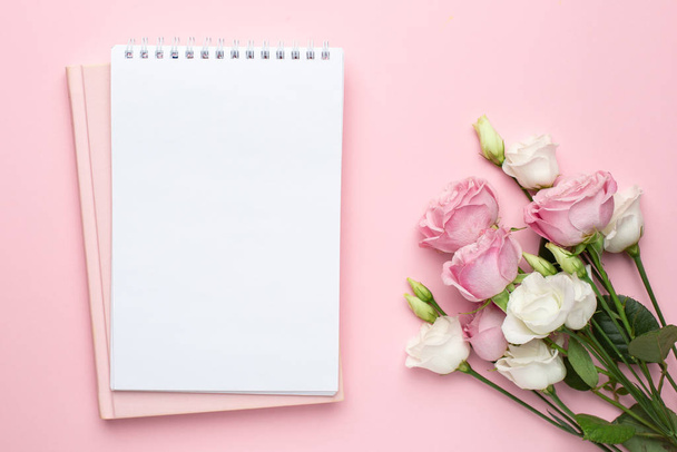 Beautiful white and pink roses flower and notebook on pastel background. Minimalistic composition for the holidays,valentines day and womens day. - Fotoğraf, Görsel