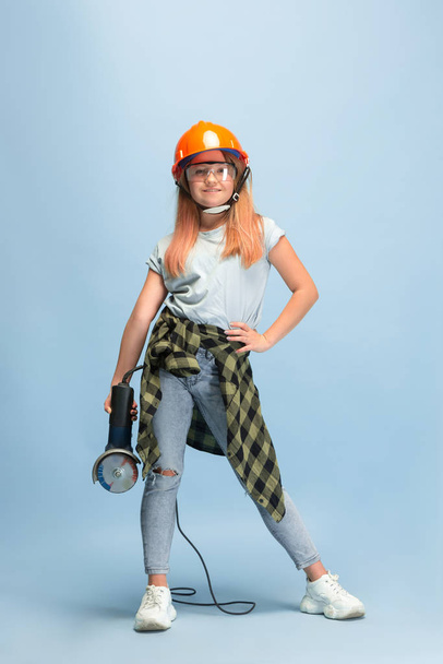 Girl dreaming about future profession of engineer - Foto, Imagen
