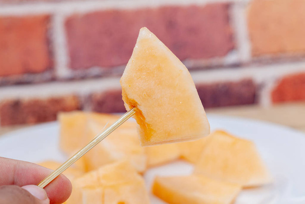 close up of sliced of melon on plate - Foto, Imagem