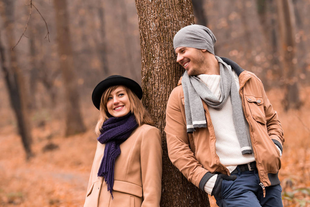 Couple in the park enjoying nice autumn / winter time. - Photo, Image