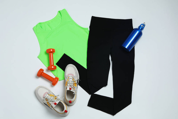 Composition with sportswear on white background, top view - Foto, imagen