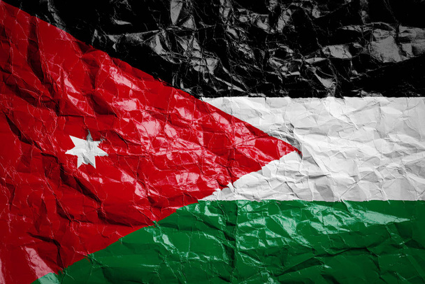 Drapeau national de Jordanie sur papier froissé. Drapeau imprimé sur une feuille. Image du drapeau pour la conception sur flyers, publicité
. - Photo, image