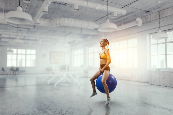 Sporty woman on fitness ball. Mixed media - Zdjęcie, obraz