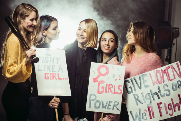 smiling happy feminists women together in smoky space - Фото, изображение