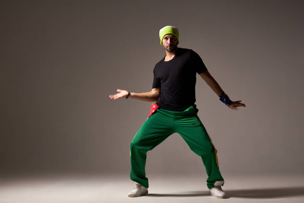 Cool looking dancing hiphopper in sportswear. - Fotoğraf, Görsel