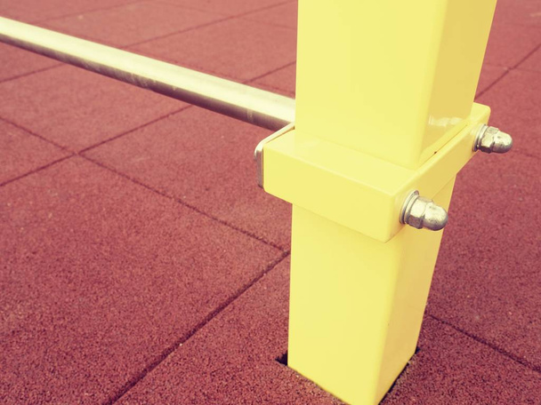 Yellow iron bar on workout playground. The beam holds  - Photo, Image