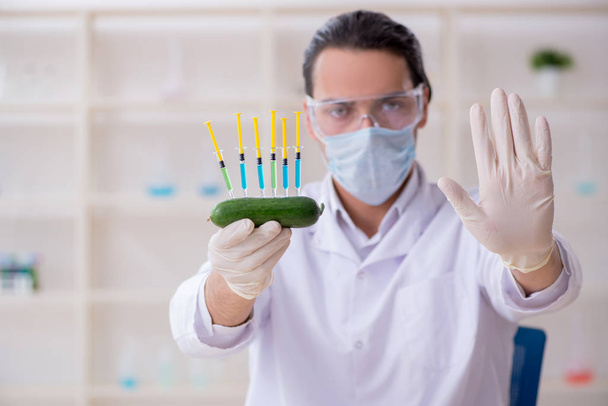 Male nutrition expert testing food products in lab - Photo, Image