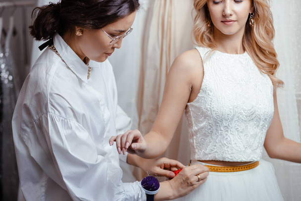 romantic bride in designers wedding salon - Фото, изображение