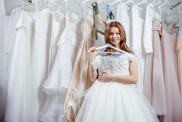 young happy bride look for beautiful wedding dress - Foto, Imagem