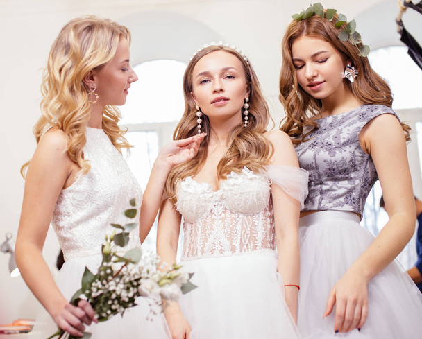 good-looking three women together in wedding dresses - Фото, изображение