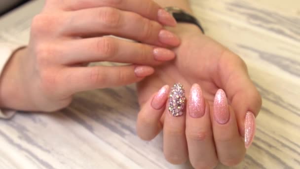 Nails Art Design. Hands With natural Manicure On light Background. Close Up Of Female Hands With Trendy decorations.With pink Close Up View, slow motion - Footage, Video