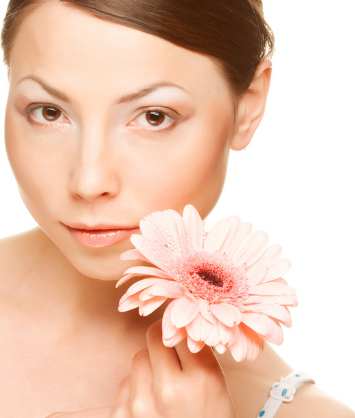 Young woman with gerber flower - 写真・画像