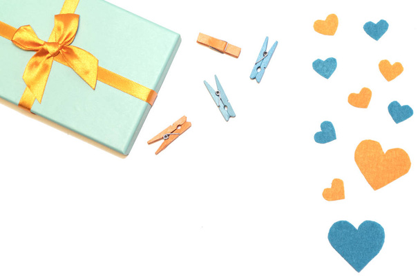 White background with present, felt heart, clothespins. - Photo, Image