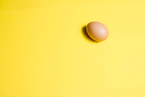 Fresh Easter Egg on a Yellow Background. Happy Easter - Fotoğraf, Görsel