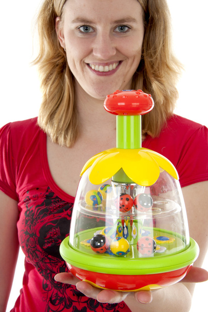 Woman is holding play toy - Foto, afbeelding