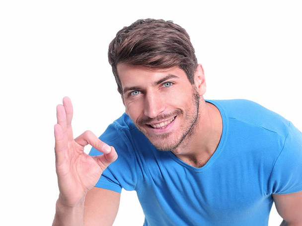 handsome guy showing OK gesture. isolated on white - Φωτογραφία, εικόνα