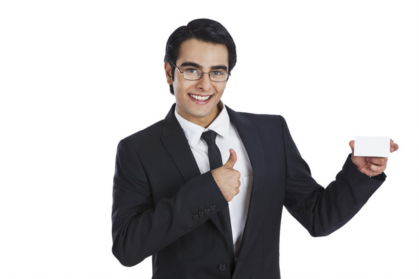 Businessman showing a blank business card - Foto, imagen