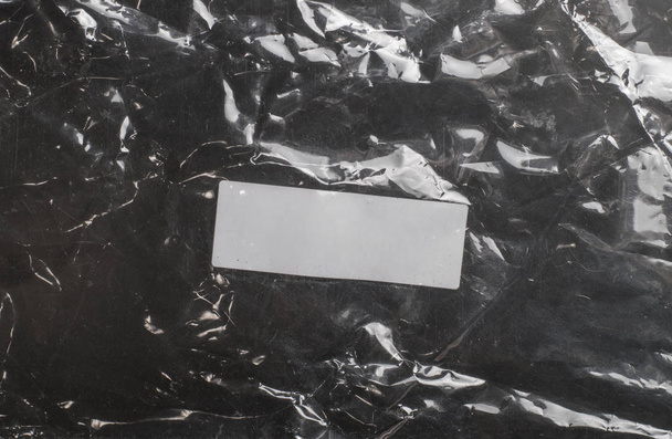 glossy polyethylene on a dark background - Photo, Image