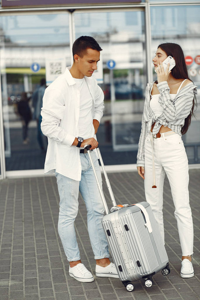 Beautiful couple standing near the airport - Foto, Bild
