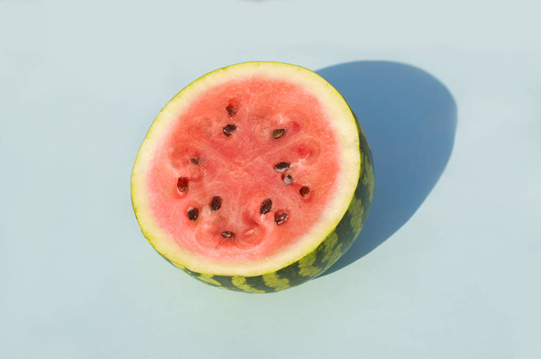 watermelon on a blue background - Fotoğraf, Görsel