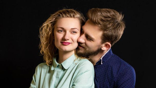 young sexy couple portrait photo on black background - 写真・画像
