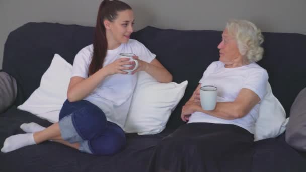 Senior woman talking with granddaughter. - Felvétel, videó