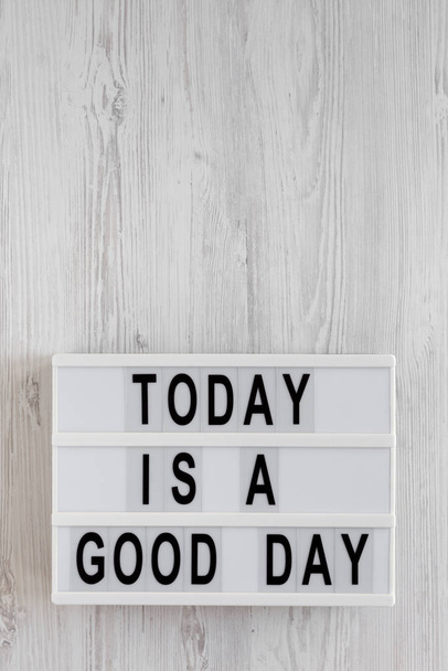 'Today is a good day' words on a lightbox on a white wooden back - Photo, Image
