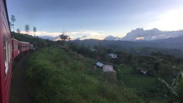 Ella, Sri Lanka, red train against the backdrop of tea plantations - Video, Çekim
