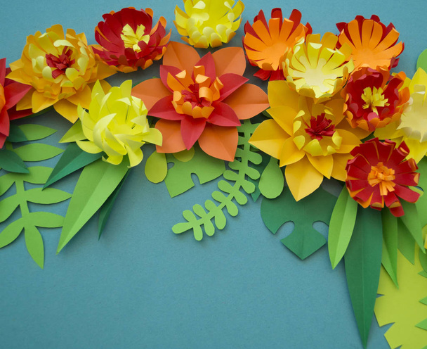 Flowers made of paper. Blue background. - Foto, Imagen