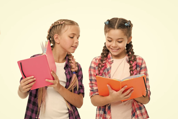 Reading skills. Cute small children holding books. Adorable little girls with school exercise books. Preparing activity books for writing. Study language. Achieve knowledge. Education concept - Φωτογραφία, εικόνα