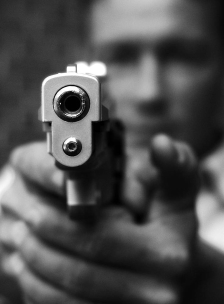 black and white photo of a pistol - Fotó, kép