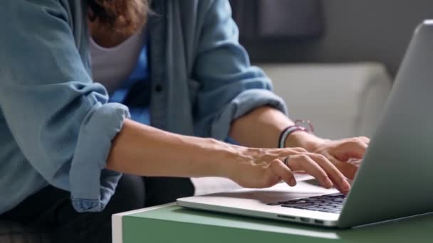 Close Up shot of womans hand working at the laptop. - Felvétel, videó