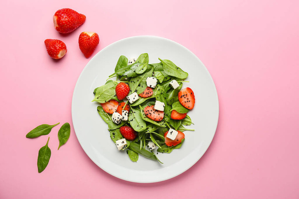 Plate with tasty salad on color background - Фото, изображение