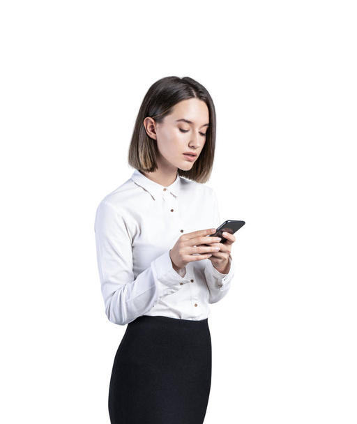 Serious young businesswoman with smartphone - Φωτογραφία, εικόνα