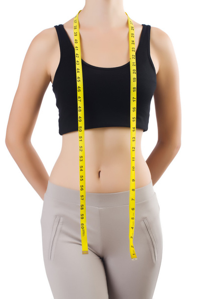 Молодая девушка с сантиметром в диете - Фото, изображение