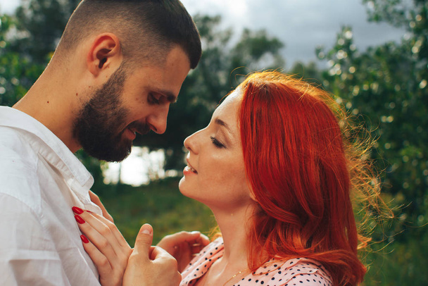 happy, couple in love cuddling, Redhead girl. minute to kiss. date - Foto, Bild