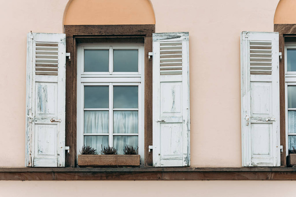 old houses facade with windows and folding shutters - Valokuva, kuva