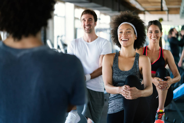 Picture of cheerful happy fit fitness team in gym - Fotoğraf, Görsel