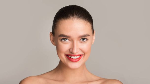 Girl with perfect toothy smile and red lips smiling to camera - Fotografie, Obrázek