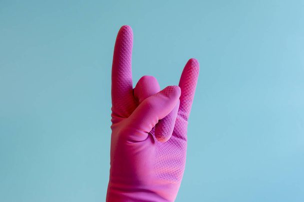 Hand with cleaning glove gesturing - Foto, immagini