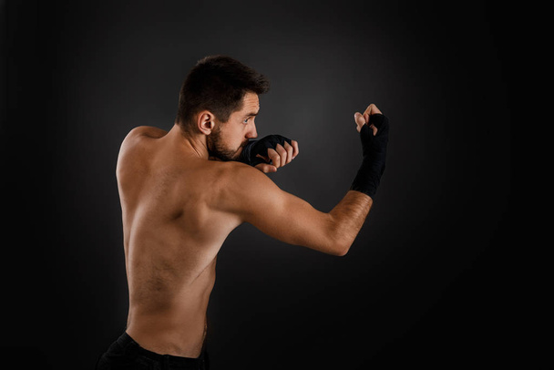 boxer throwing a fierce and powerful punch. - 写真・画像