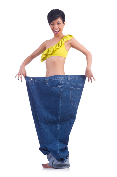 Femme dans un concept de régime avec de gros jeans - Photo, image