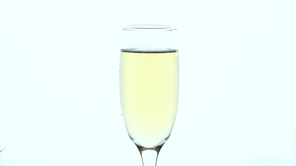 Champagne Glass Closeup - strawberry is dropped into full glass - Metraje, vídeo