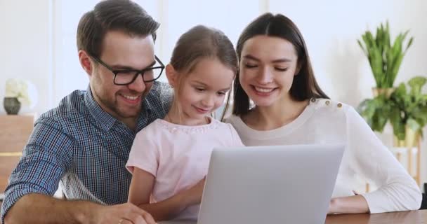 Happy family of three bonding using laptop computer at home - Video, Çekim