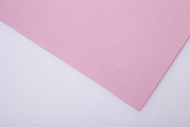 Vaaleanpunainen ja valkoinen pastelli paperi rakenne taustana. Yläkuva
 - Valokuva, kuva